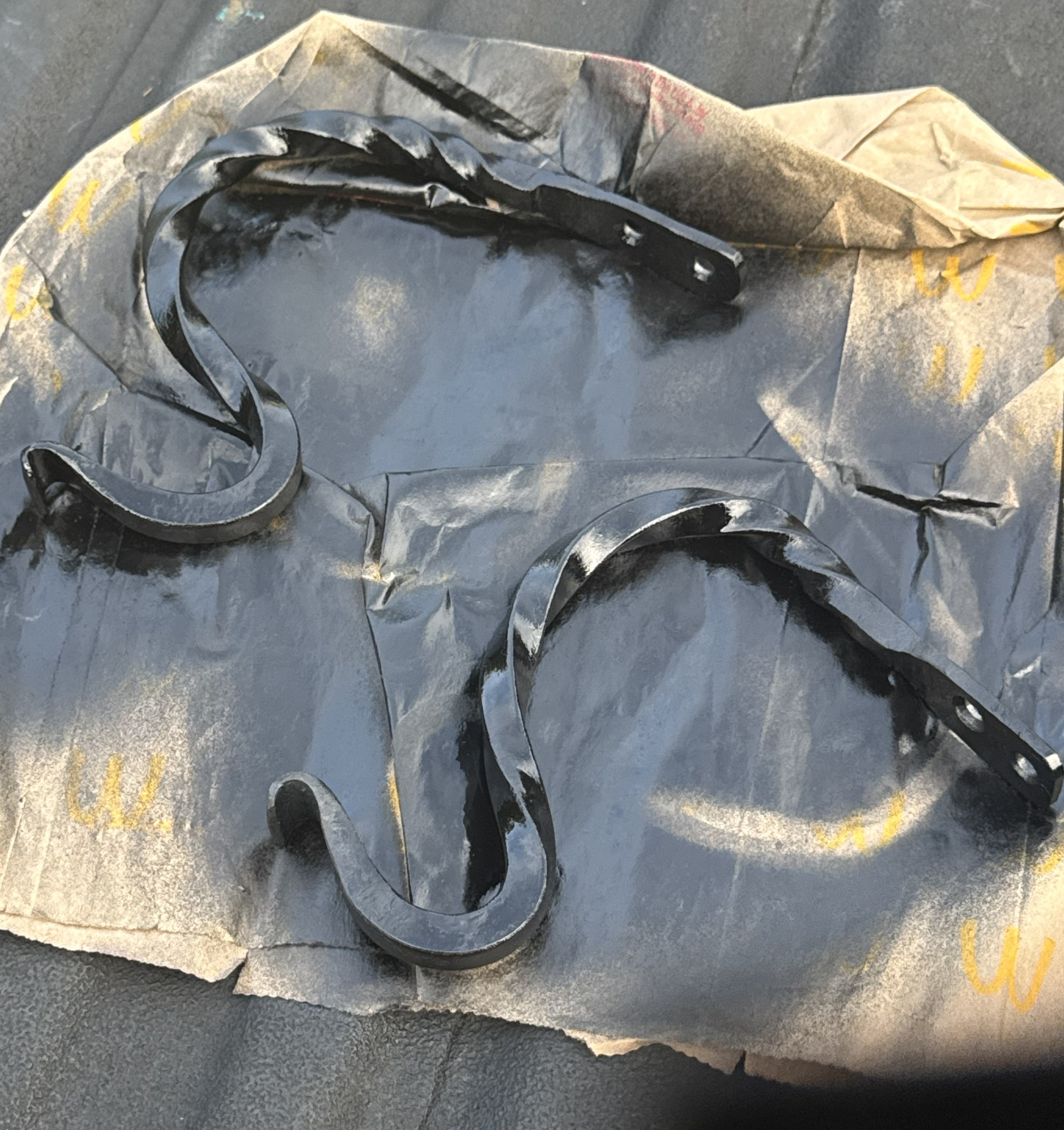 Painted forged hooks drying after finish